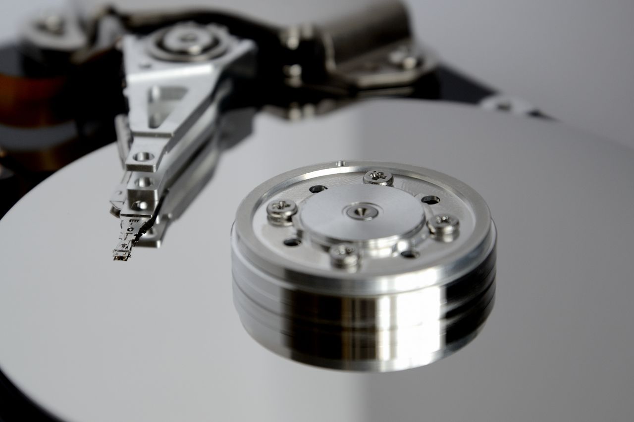 Crafting Captivating Headlines: Your awesome post title goes here Detailed view of hard drive mechanism showcasing metallic precision parts.